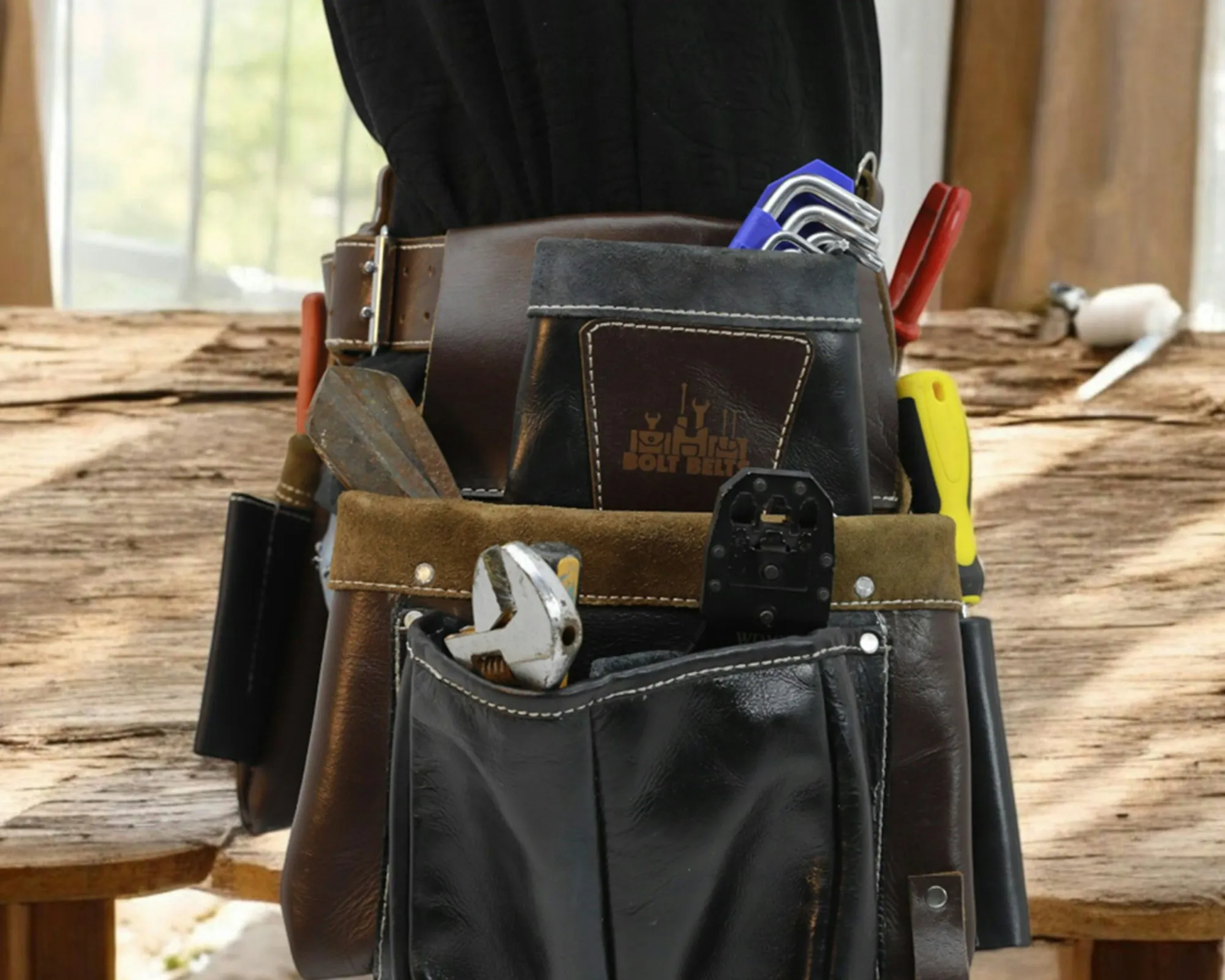 Electrician tool belt holding screwdrivers and pliers