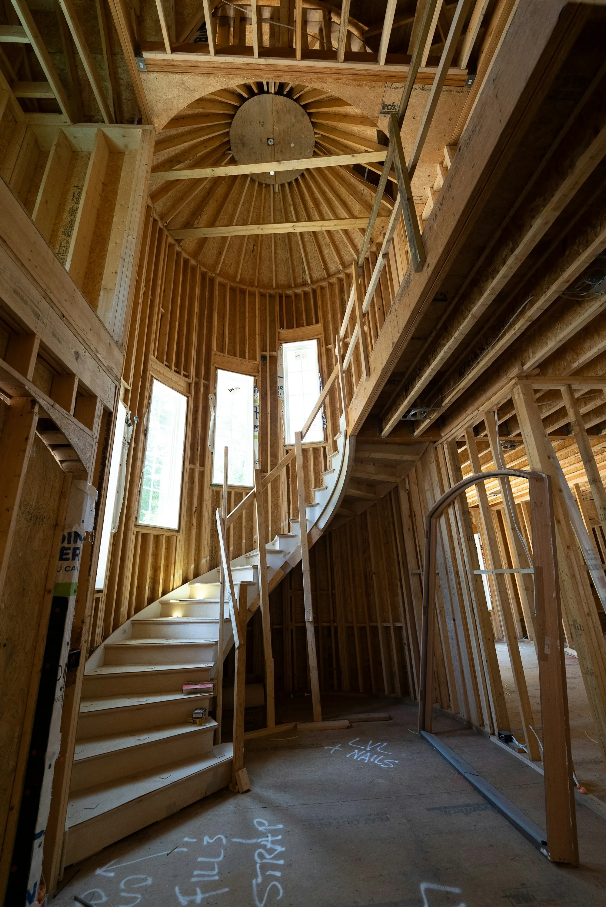 Timber-framed staircase inside a house under construction